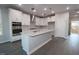 Beautiful kitchen with stainless steel appliances, a kitchen island and white cabinetry at 2715 Hunter Woods Dr # 562, Apex, NC 27502
