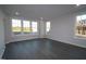 Inviting living room with plenty of natural light and gray flooring at 2715 Hunter Woods Dr # 562, Apex, NC 27502