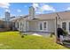 A cozy backyard with a patio, well-maintained lawn, and privacy fence at 3027 Maple Ave # D2, Burlington, NC 27215