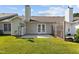 Backyard with a concrete patio, grassy area, and wooden fence at 3027 Maple Ave # D2, Burlington, NC 27215