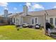 Backyard patio area ideal for entertaining with outdoor seating and grill at 3027 Maple Ave # D2, Burlington, NC 27215