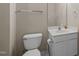 A well-lit bathroom features a classic toilet, white vanity, and sleek fixtures, offering a clean aesthetic at 3027 Maple Ave # D2, Burlington, NC 27215