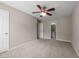 Cozy carpeted bedroom with a ceiling fan and attached bathroom at 3027 Maple Ave # D2, Burlington, NC 27215