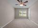 Large bedroom with a ceiling fan and natural light at 3027 Maple Ave # D2, Burlington, NC 27215