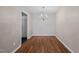 A simply decorated dining space features warm-toned walls and a striking chandelier, offering a cozy ambiance at 3027 Maple Ave # D2, Burlington, NC 27215
