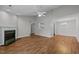 An open-plan living area is illuminated by a ceiling fan and features seamless flooring throughout at 3027 Maple Ave # D2, Burlington, NC 27215