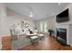 Bright living room featuring hardwood floors, fireplace, and access to the backyard at 3027 Maple Ave # D2, Burlington, NC 27215