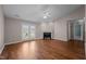 The living room has a vaulted ceiling, fireplace, ceiling fan, and doors to the outside space at 3027 Maple Ave # D2, Burlington, NC 27215