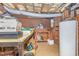 Unfinished basement space with water heater, wooden workbench and storage boxes at 3412 Hackney Ct, Raleigh, NC 27613