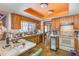 Well-lit kitchen featuring wood cabinets, ample counter space, and vintage elements at 3412 Hackney Ct, Raleigh, NC 27613