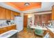 Kitchen featuring wood cabinets, table and vintage design elements at 3412 Hackney Ct, Raleigh, NC 27613