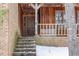 Home's entryway with brick stairs, wood porch and front door at 3412 Hackney Ct, Raleigh, NC 27613