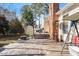 Backyard of home featuring a wooden deck, shed, lush green lawn, and mature trees at 400 Cedarmere Dr, Wendell, NC 27591