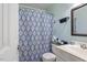 Bathroom featuring white vanity, toilet, and patterned shower curtain at 400 Cedarmere Dr, Wendell, NC 27591