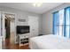 Bedroom featuring hardwood floors, a bed, and bright window curtains at 400 Cedarmere Dr, Wendell, NC 27591