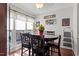 Dining room featuring hardwood floors, bright windows, and modern decor at 400 Cedarmere Dr, Wendell, NC 27591
