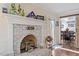 Close up of the living room fireplace, mantel, and decor, and view into dining room at 400 Cedarmere Dr, Wendell, NC 27591
