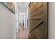 Hallway featuring rustic barn door and hardwood floors at 400 Cedarmere Dr, Wendell, NC 27591
