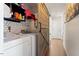 Laundry room with geometric backsplash and rustic barn door at 400 Cedarmere Dr, Wendell, NC 27591