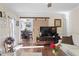 Bright living room with hardwood floors, fireplace, barn door, and view into dining room at 400 Cedarmere Dr, Wendell, NC 27591