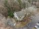 Aerial view of the community with parking and surrounding trees at 401 Oak Hollow Ct, Raleigh, NC 27613