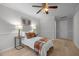 Bright bedroom with hardwood floors, ceiling fan, and modern decor at 401 Oak Hollow Ct, Raleigh, NC 27613