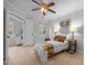 Inviting bedroom with hardwood floors, ceiling fan, and natural light at 401 Oak Hollow Ct, Raleigh, NC 27613