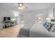 Bedroom with ceiling fan, wood floors, and two windows for great natural light at 401 Oak Hollow Ct, Raleigh, NC 27613
