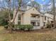 Two-story home with dual patios and well-manicured landscaping at 401 Oak Hollow Ct, Raleigh, NC 27613