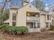 Two-story home with dual patios and well-manicured landscaping at 401 Oak Hollow Ct, Raleigh, NC 27613