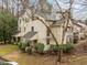Inviting two-story townhouse with charming front porch and manicured landscaping at 401 Oak Hollow Ct, Raleigh, NC 27613