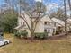 Two-story home with dual patios and well-manicured landscaping at 401 Oak Hollow Ct, Raleigh, NC 27613