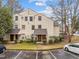 Charming two-story townhomes in a community setting with parking and lush surroundings at 401 Oak Hollow Ct, Raleigh, NC 27613