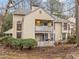 Two-story home with dual patios and well-manicured landscaping at 401 Oak Hollow Ct, Raleigh, NC 27613