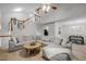 Spacious living room with vaulted ceilings, hardwood floors, and a large sectional sofa at 401 Oak Hollow Ct, Raleigh, NC 27613