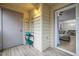 Patio with door to the interior of home with a decorative plant stand and storage door at 401 Oak Hollow Ct, Raleigh, NC 27613