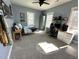 Bedroom with neutral walls, black bed frame, and modern work space at 42 Miry Branch Ct, Garner, NC 27529