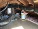 Spacious attic with exposed beams, mechanicals, and natural light at 4319 Denfield St, Durham, NC 27704