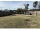 The backyard is surrounded by a wood fence with an outbuilding on the premises at 4319 Denfield St, Durham, NC 27704