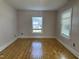 This bedroom boasts beautiful hardwood floors and two windows that provide natural light at 4319 Denfield St, Durham, NC 27704