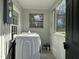 Enclosed laundry room featuring washer and dryer hook ups and access to the outdoors at 4319 Denfield St, Durham, NC 27704