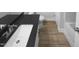 Modern bathroom featuring a large sink, dark countertop, ceramic tile flooring, and neutral paint at 475 Bramble Ln, Clayton, NC 27527