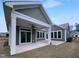 Gray siding adorns the exterior of this home, which features a covered patio at 475 Bramble Ln, Clayton, NC 27527