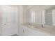 Bright bathroom featuring dual sinks, modern fixtures, a large mirror, and a walk-in shower at 519 Old Battle Bridge Rd, Wendell, NC 27591