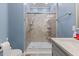 Modern bathroom showcasing a glass-enclosed shower with tiled walls and updated fixtures at 5904 River Lake Cir, Raleigh, NC 27604