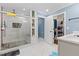 Modern bathroom with a tiled shower, shelving, and a spacious vanity at 5904 River Lake Cir, Raleigh, NC 27604