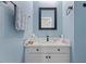 Cozy bathroom with a white vanity, modern fixtures, and a soothing blue color scheme at 5904 River Lake Cir, Raleigh, NC 27604