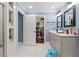 Bathroom with a tiled shower, vanity, and a closet for extra storage at 5904 River Lake Cir, Raleigh, NC 27604