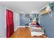 Bedroom featuring hardwood floors, natural light, and charming decor at 5904 River Lake Cir, Raleigh, NC 27604
