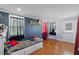 Bedroom featuring hardwood floors, natural light, and charming decor at 5904 River Lake Cir, Raleigh, NC 27604